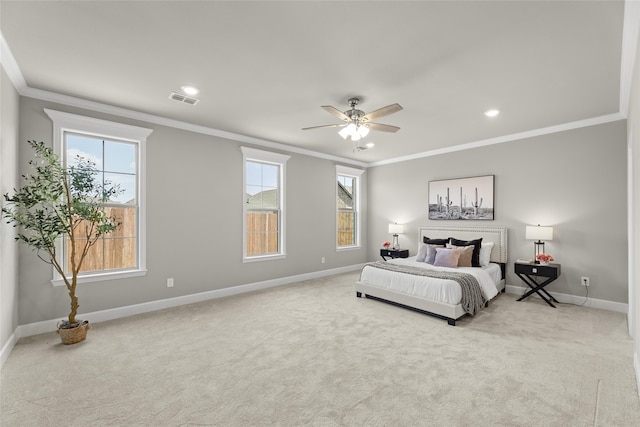 carpeted bedroom featuring ceiling fan, ornamental molding, and multiple windows