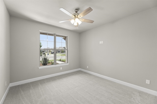 empty room featuring carpet and ceiling fan