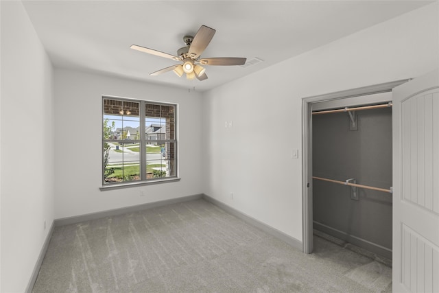 unfurnished bedroom with carpet flooring, a closet, and ceiling fan