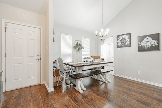 dining room featuring a notable chandelier, lofted ceiling, and dark wood-type flooring