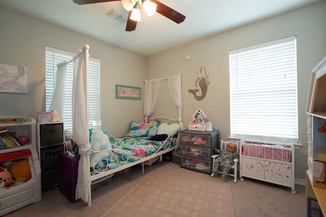 carpeted bedroom with ceiling fan