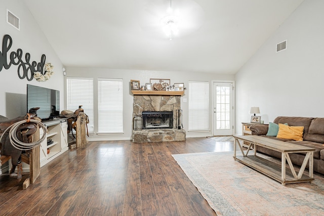 living room with a fireplace, dark hardwood / wood-style flooring, a wealth of natural light, and ceiling fan