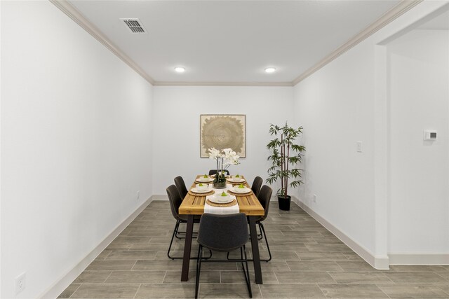 dining room with crown molding