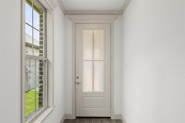 doorway with crown molding and light wood-type flooring