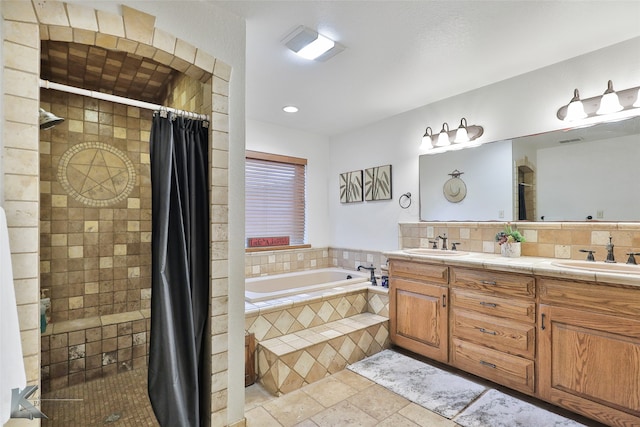 bathroom with a relaxing tiled bath, tile flooring, tasteful backsplash, double sink, and large vanity