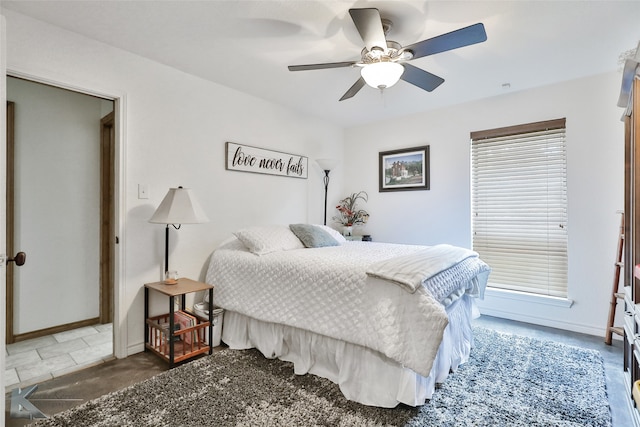 bedroom featuring tile floors and ceiling fan