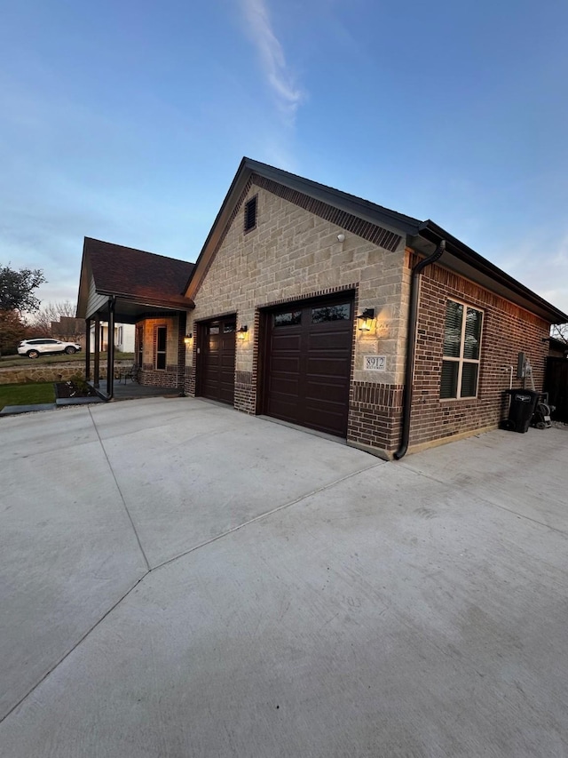 property exterior at dusk with a garage