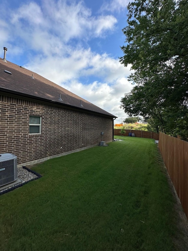 view of yard featuring central AC unit