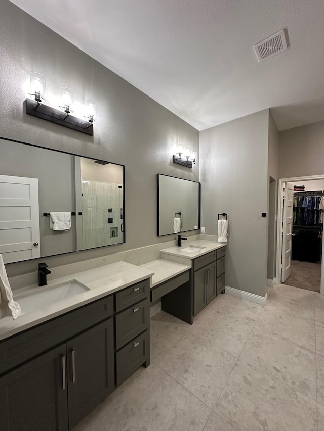 bathroom with a shower and vanity