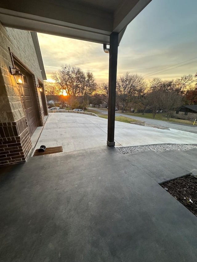 view of patio terrace at dusk