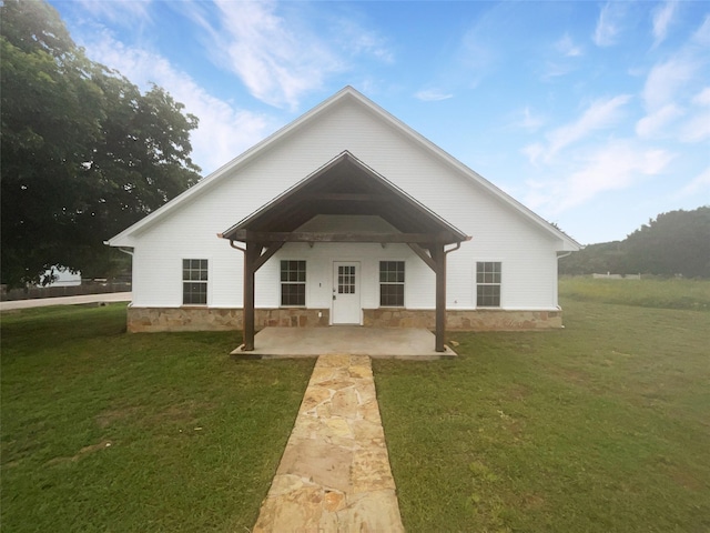 exterior space with a lawn and a patio