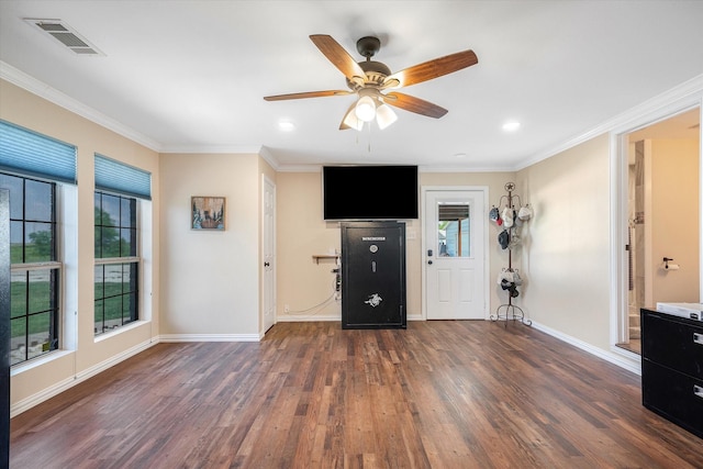 interior space featuring ornamental molding, ceiling fan, and dark wood-type flooring