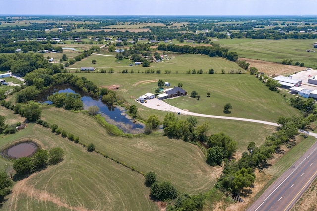 bird's eye view with a rural view and a water view