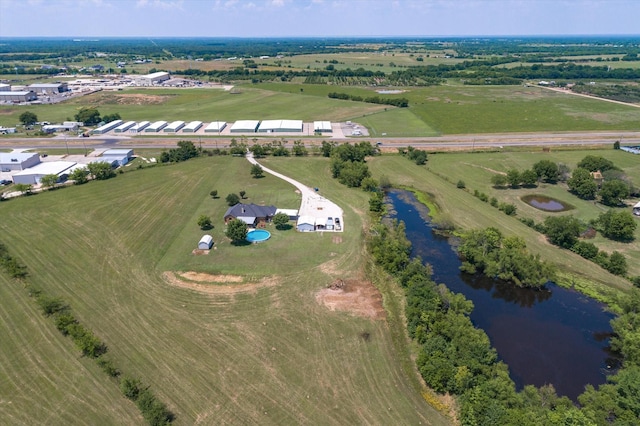 aerial view with a rural view and a water view