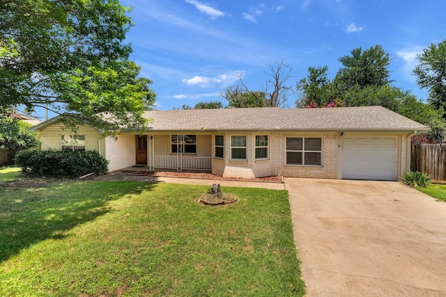 ranch-style house with a garage, driveway, a porch, and a front yard