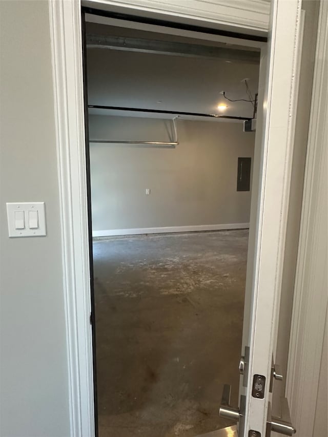 interior space with a garage door opener and electric panel