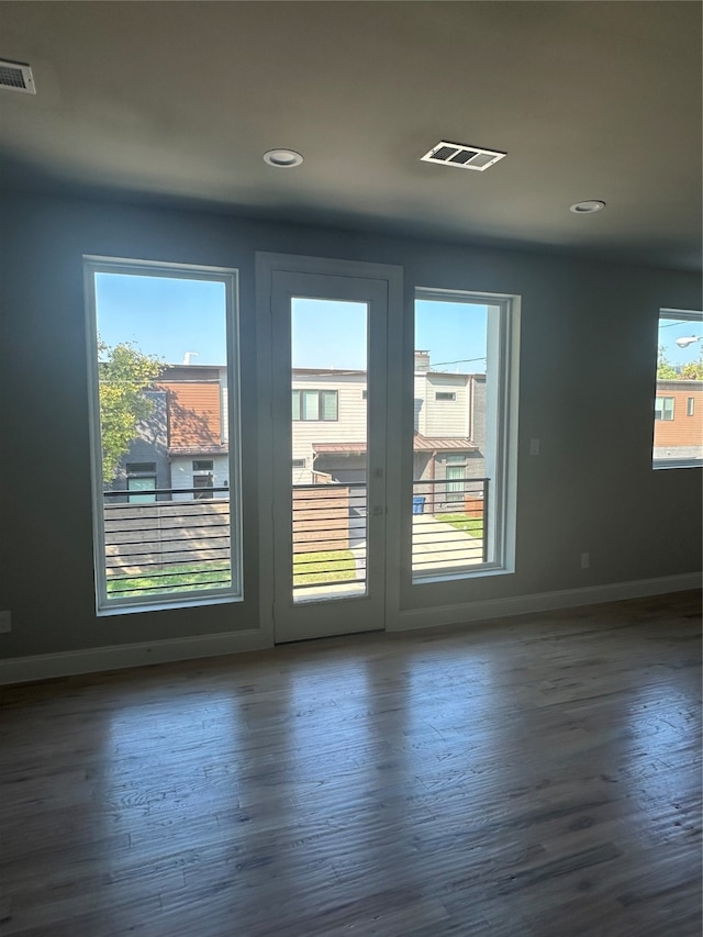 unfurnished room featuring dark wood-type flooring