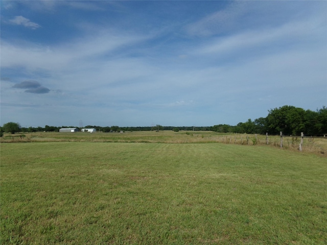 view of yard with a rural view