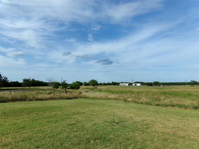 view of yard with a rural view