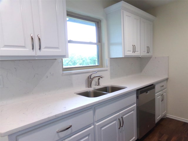 kitchen featuring white cabinetry, dishwasher, sink, backsplash, and light stone countertops