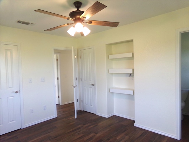 unfurnished bedroom with ceiling fan and dark hardwood / wood-style flooring