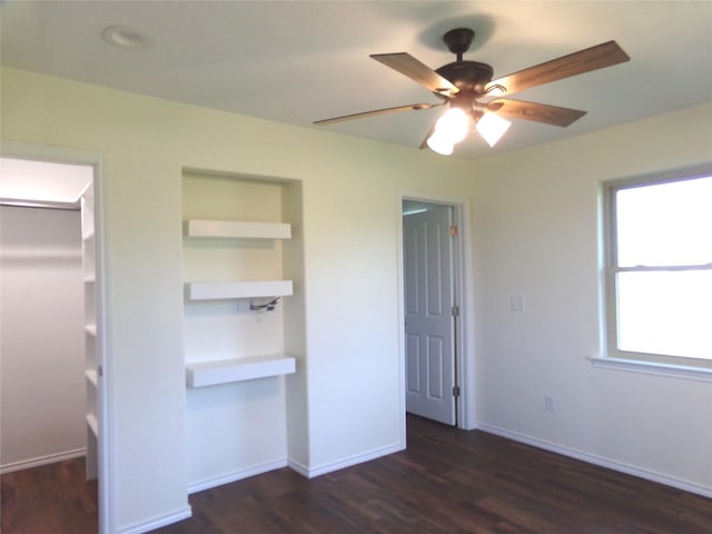 unfurnished bedroom featuring dark hardwood / wood-style flooring and ceiling fan