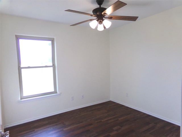 spare room featuring ceiling fan and dark hardwood / wood-style flooring