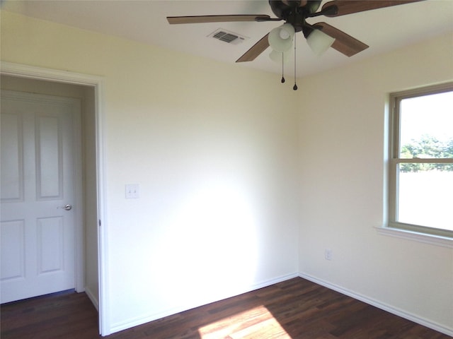 spare room featuring dark hardwood / wood-style floors