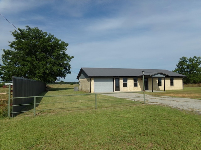 view of front of home with a garage and a front yard