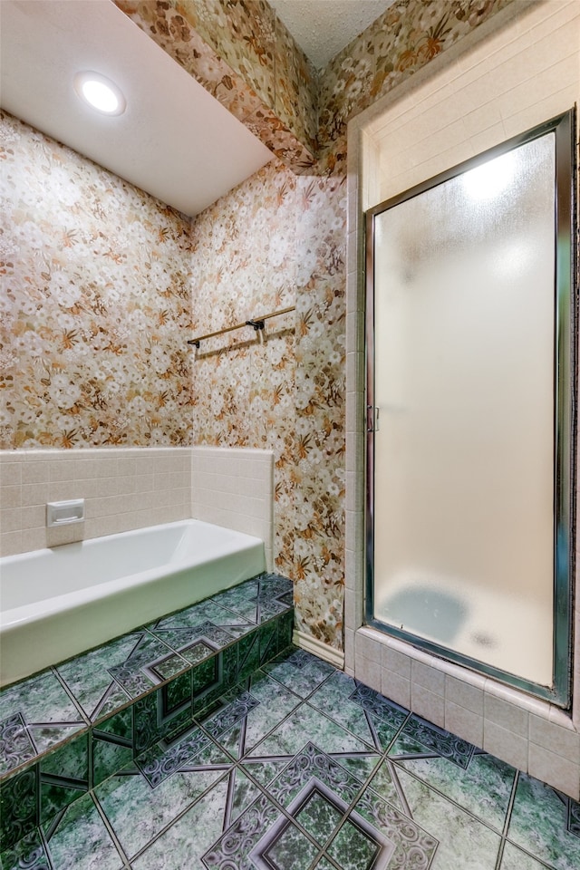 bathroom featuring shower with separate bathtub and tile patterned floors