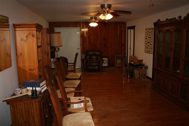 dining room with ceiling fan and dark hardwood / wood-style flooring