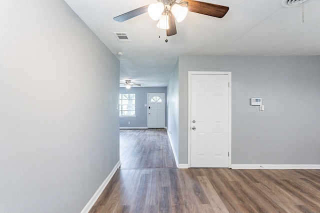 hallway with dark wood-type flooring