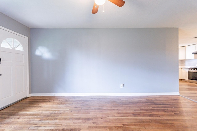 entrance foyer featuring ceiling fan and light hardwood / wood-style flooring