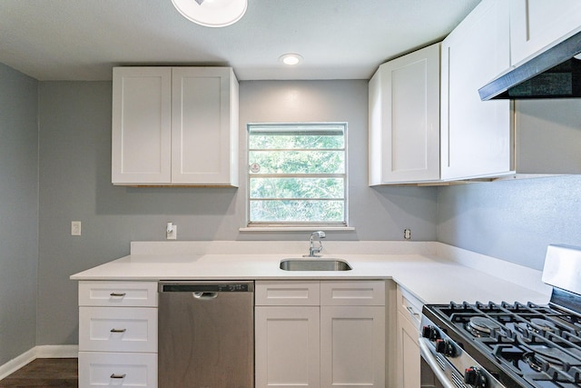 kitchen with white cabinetry, sink, and appliances with stainless steel finishes