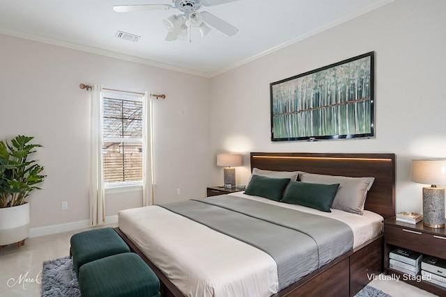 carpeted bedroom featuring ceiling fan and ornamental molding