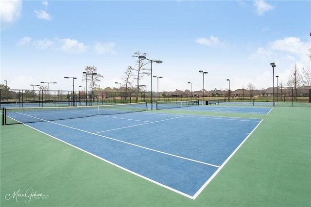 view of sport court featuring basketball hoop