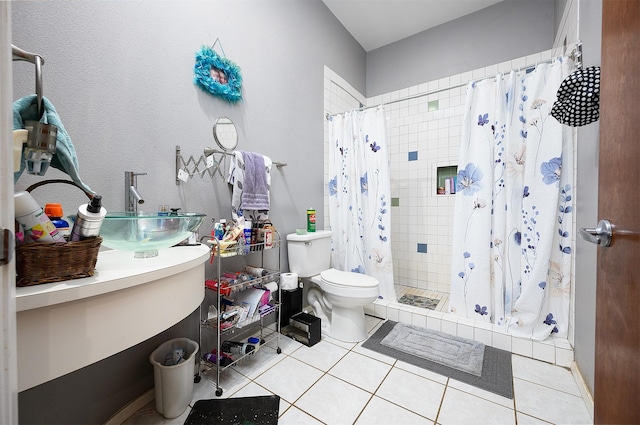 bathroom with tile patterned flooring, vanity, curtained shower, and toilet