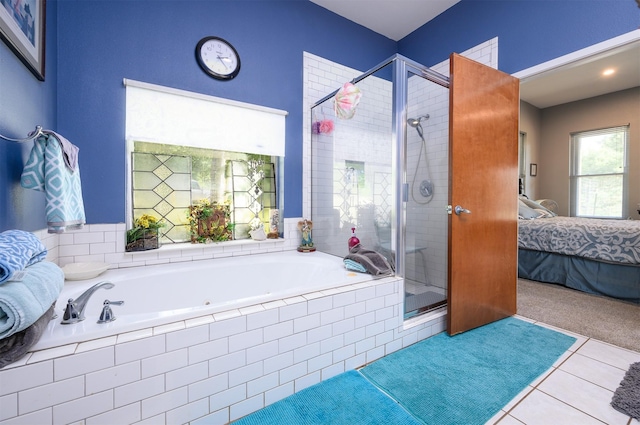 bathroom with tile patterned flooring and independent shower and bath