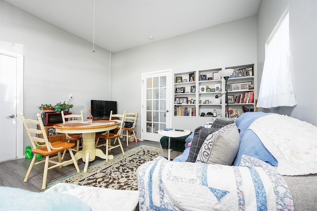 living room with french doors and wood-type flooring