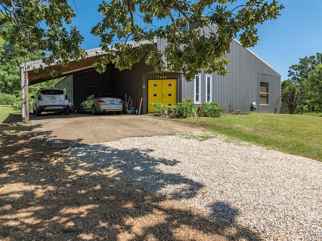 view of front facade with a carport and a front yard