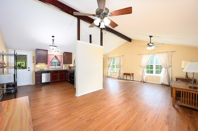 living room with ceiling fan, wood-type flooring, and lofted ceiling with beams