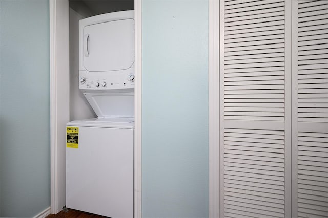 washroom featuring stacked washer / dryer