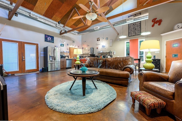 living room featuring ceiling fan, high vaulted ceiling, and french doors