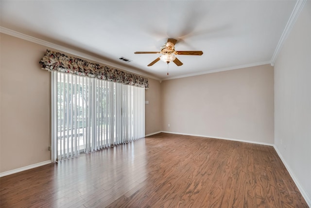 empty room with dark hardwood / wood-style flooring, ceiling fan, and crown molding