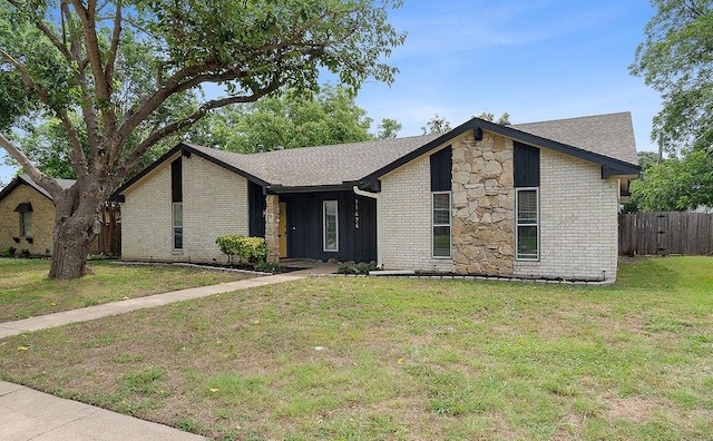 ranch-style house with a front yard