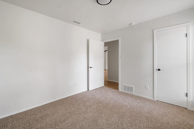 spare room with carpet floors