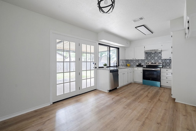 kitchen featuring light wood-type flooring, stainless steel appliances, extractor fan, sink, and white cabinets