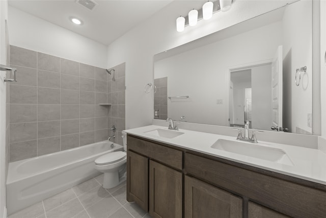 full bath featuring shower / bath combination, a sink, visible vents, and tile patterned floors