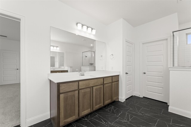 bathroom with vanity and walk in shower