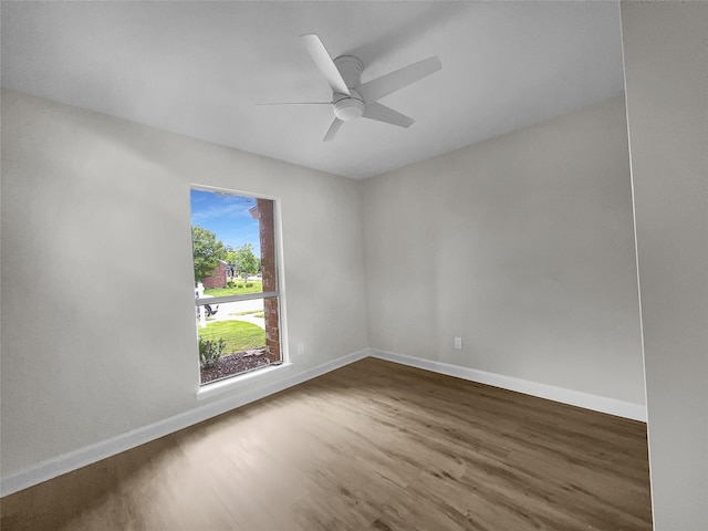 unfurnished room featuring ceiling fan and hardwood / wood-style floors